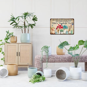 Artlunar outdoor sign enhances garden walls with playful personality.