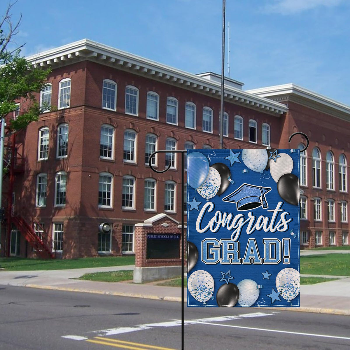 Colorfast dye preserves bright graduation artwork on Artofy flag outdoors.