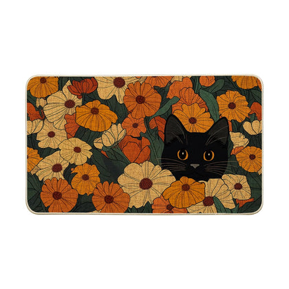 Artoid Mode black cat flowers doormat welcomes guests outdoors with a playful seasonal motif.