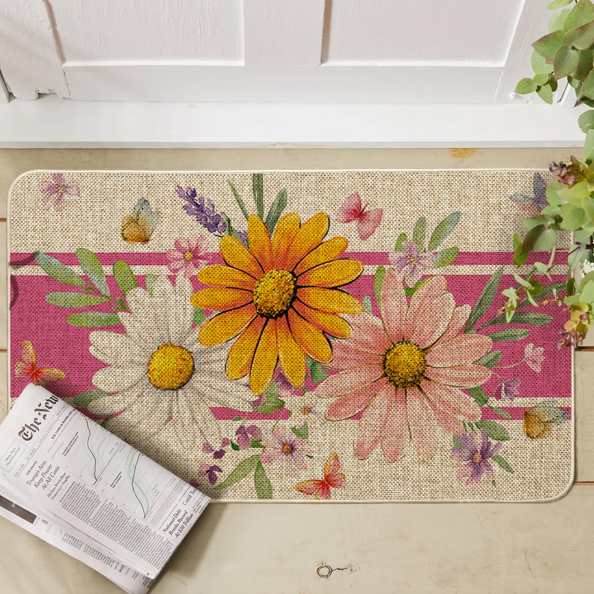 Artoid Mode pink daisy doormat designed for outdoor use and entryway appeal.