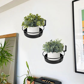 ARTORA black metal wall hanger close-up showing durable finish for outdoor use