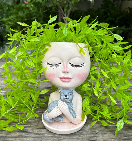 ASDFG head planter with cat hug and drainage hole for outdoor use.