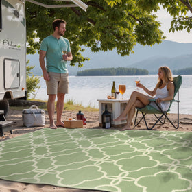 Ashler Home Deco 5x8 sage green reversible outdoor rug, ideal for deck and backyard gatherings.
