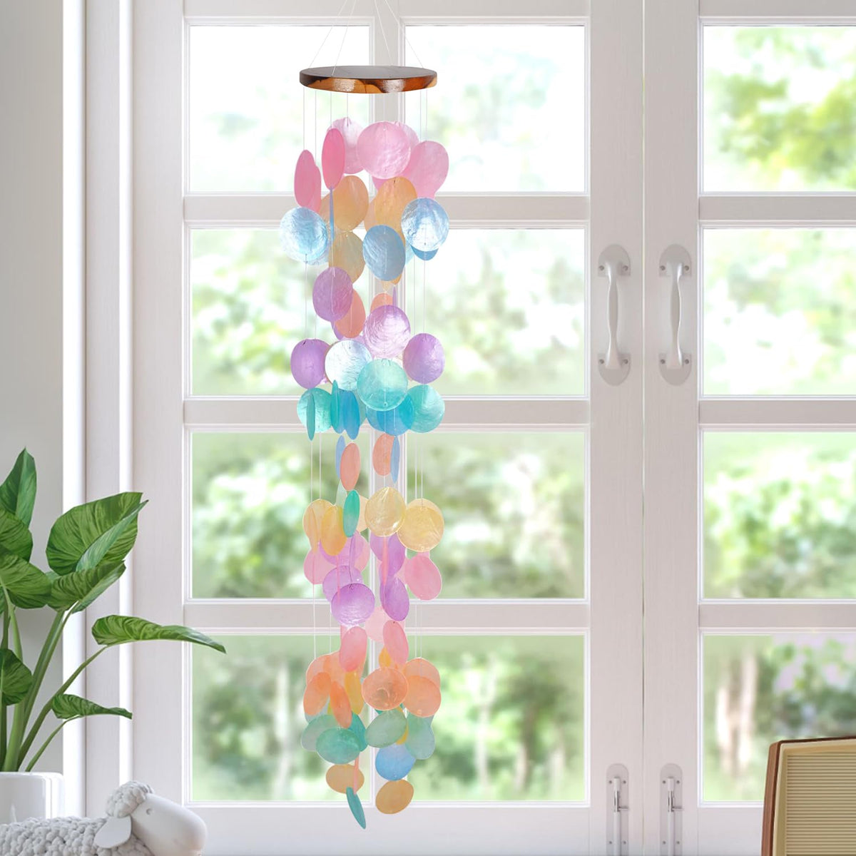 ASTARIN sunlit capiz shells create a calm, melodic breeze