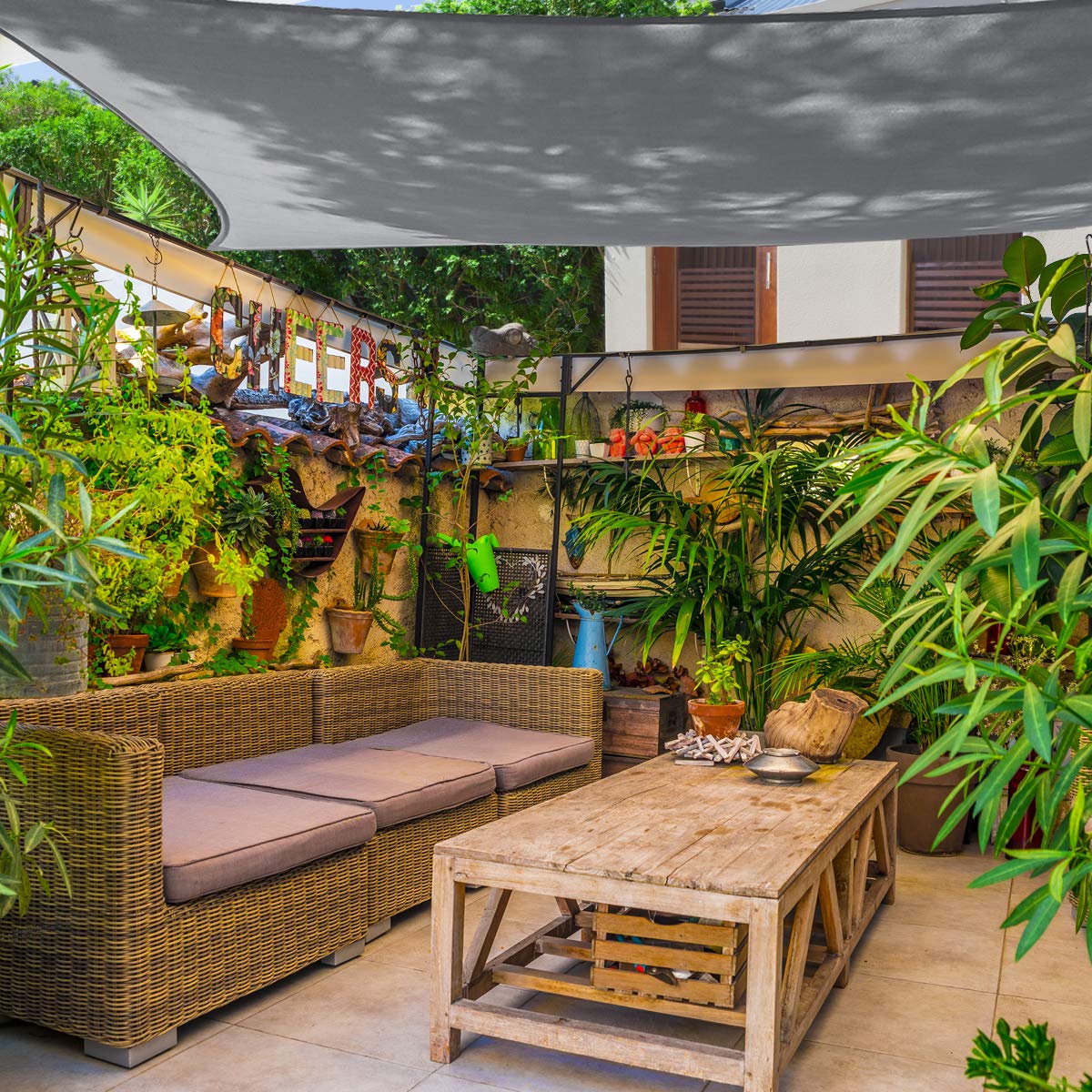 In-use setup of AsterOutdoor 8x12 shade sail over patio area.
