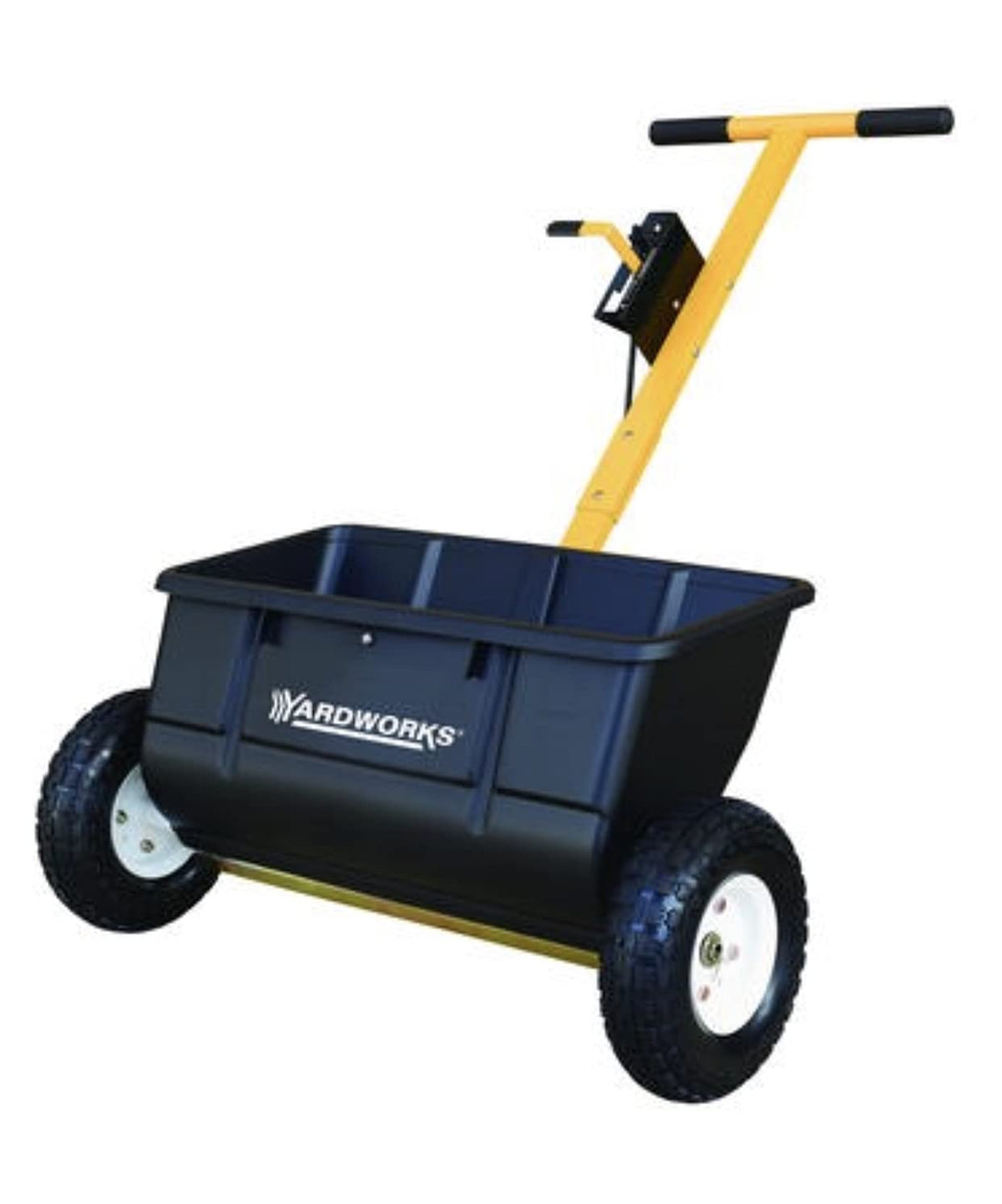 At Home 75 lb drop spreader broadcasting seed evenly across a lawn.