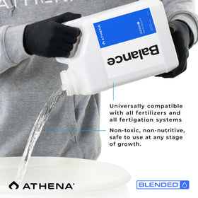 Athena Blended Balance bottle beside dosing equipment highlights easy integration.