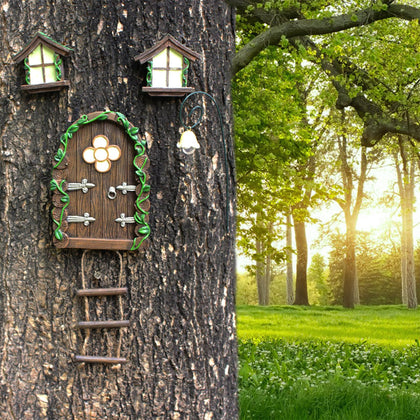 atibi fairy door on a tree trunk glows at night for magical garden ambiance