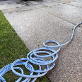 Blue Atlantic hose shows durable outdoor design for everyday watering.