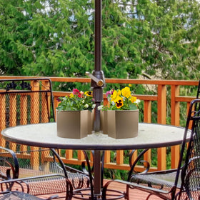 AuldHome Design planter with drain holes and plugs helps manage watering.