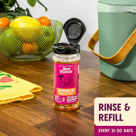 Aunt Fannie's FlyPunch bait attracting fruit flies near produce and bins.