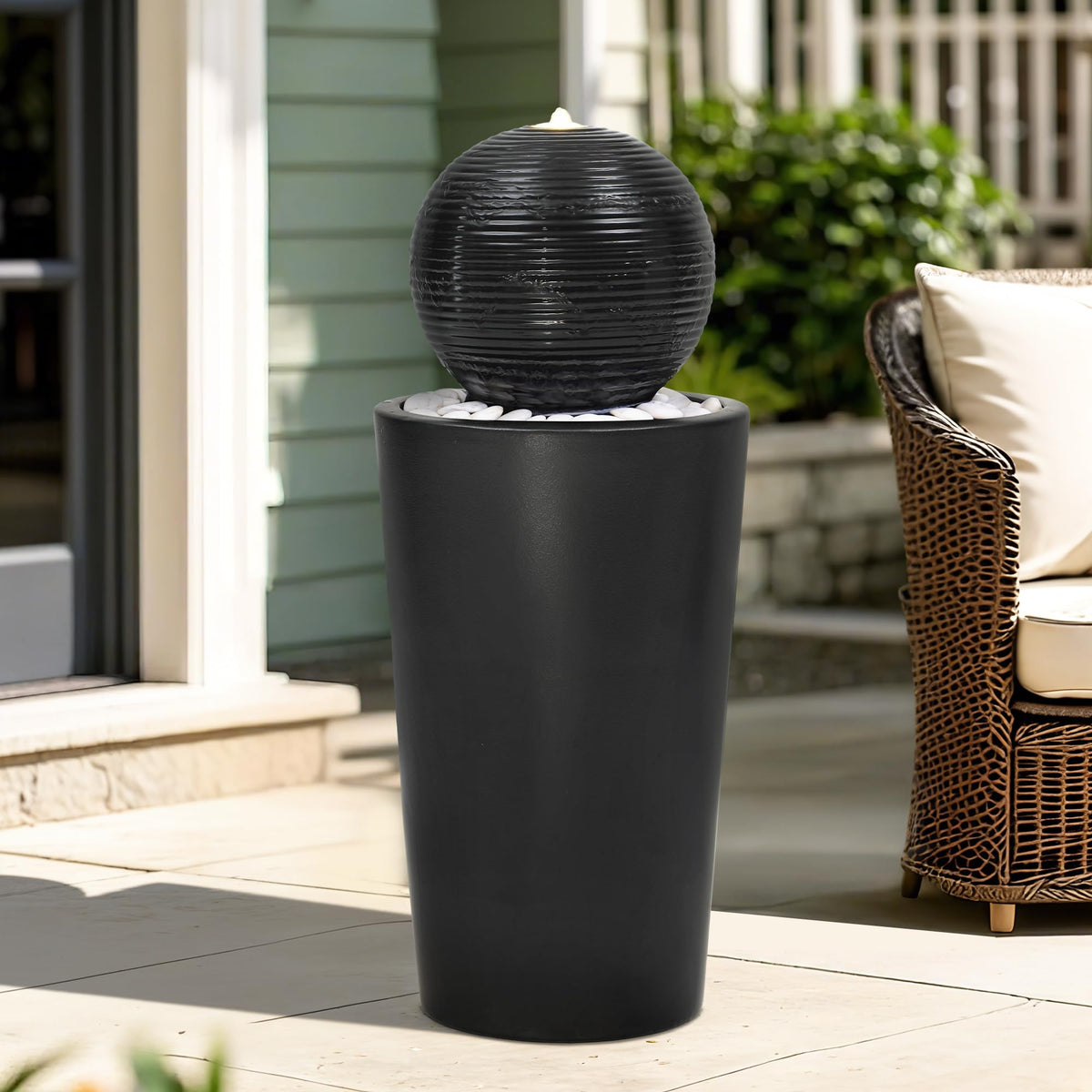 Autodaya black glaze with white pebbles, elegant outdoor decor for modern spaces.