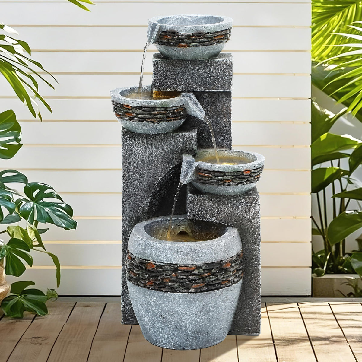 Autodaya fountain with integrated LED lighting highlights cascading water at dusk.