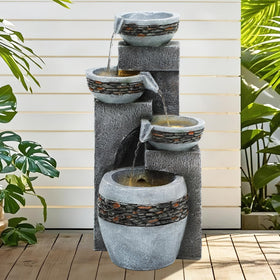 Autodaya fountain with integrated LED lighting highlights cascading water at dusk.