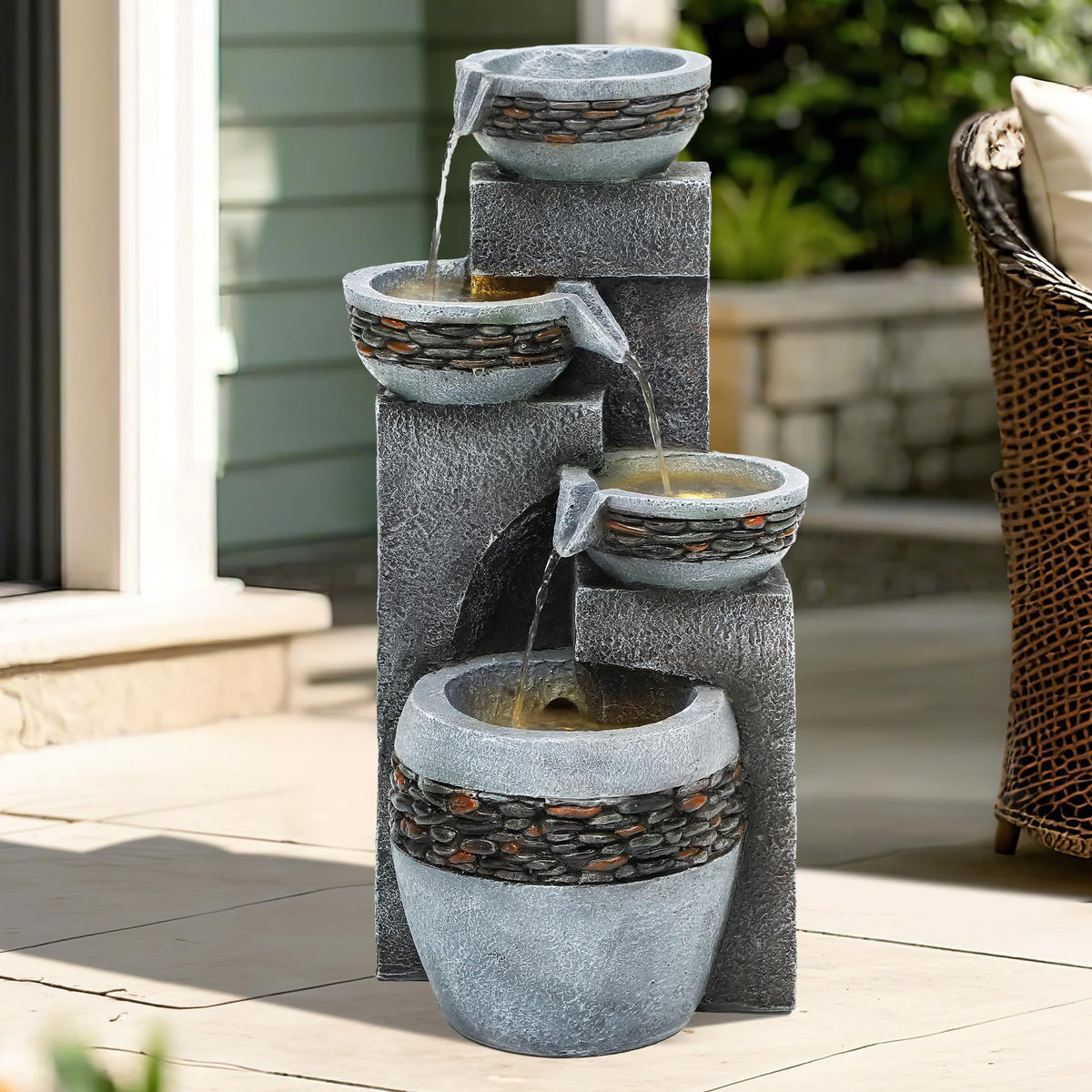 Autodaya outdoor fountain with warm LED lights creates cozy twilight patio ambiance.