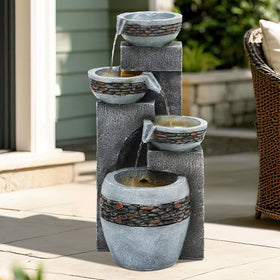 Autodaya outdoor fountain with warm LED lights creates cozy twilight patio ambiance.