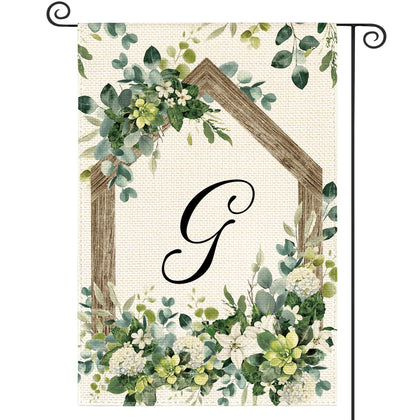 AVOIN colorlife monogram flag with G initial welcomes guests in the garden