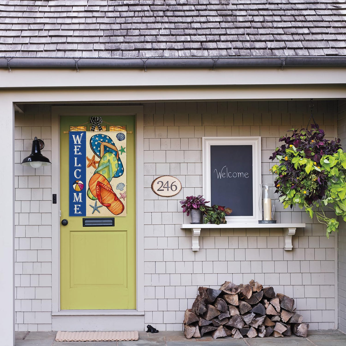 AVOIN colorlife Welcome Yard Flag displayed in a sunny patio setting.