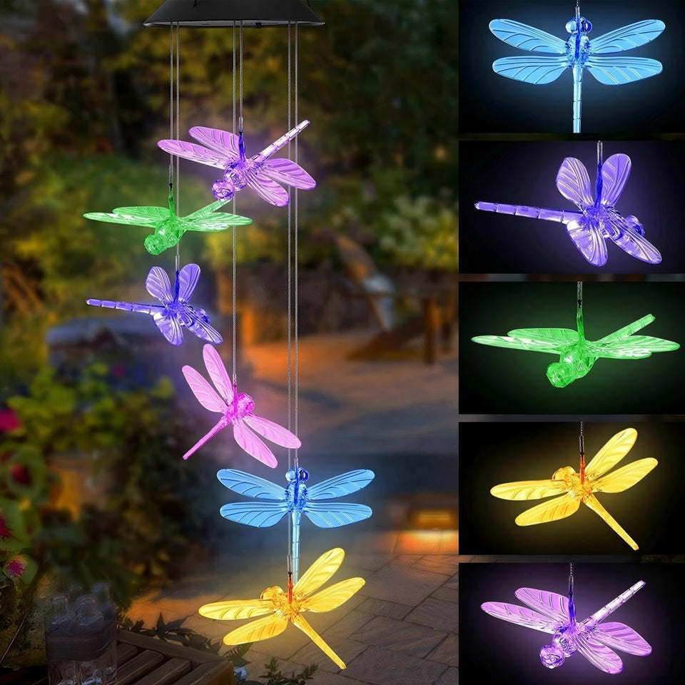 AWENDIETOU dragonfly solar wind chimes illuminate the garden with a soft multicolor glow.