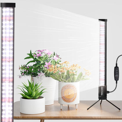 AWLYLNLL vertical grow light on a stand delivering even coverage for potted plants.