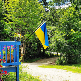 AXJBW Ukraine flag with canvas header and brass grommets, durable outdoors.