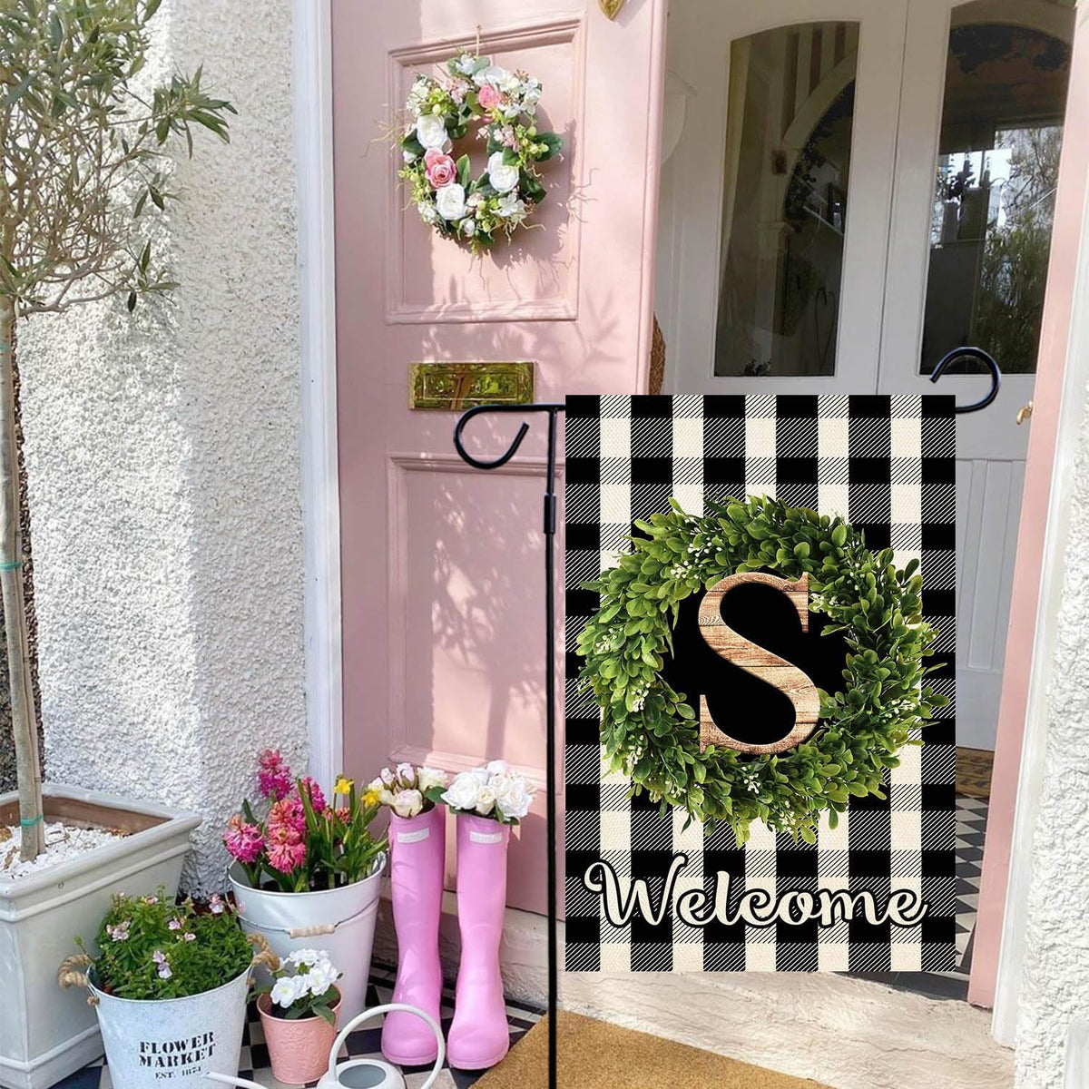 Baccessor buffalo plaid boxwood wreath flag adds festive curb appeal.