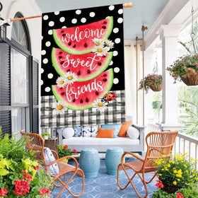 Baccessor buffalo plaid welcome flag adds a festive touch to front porch.