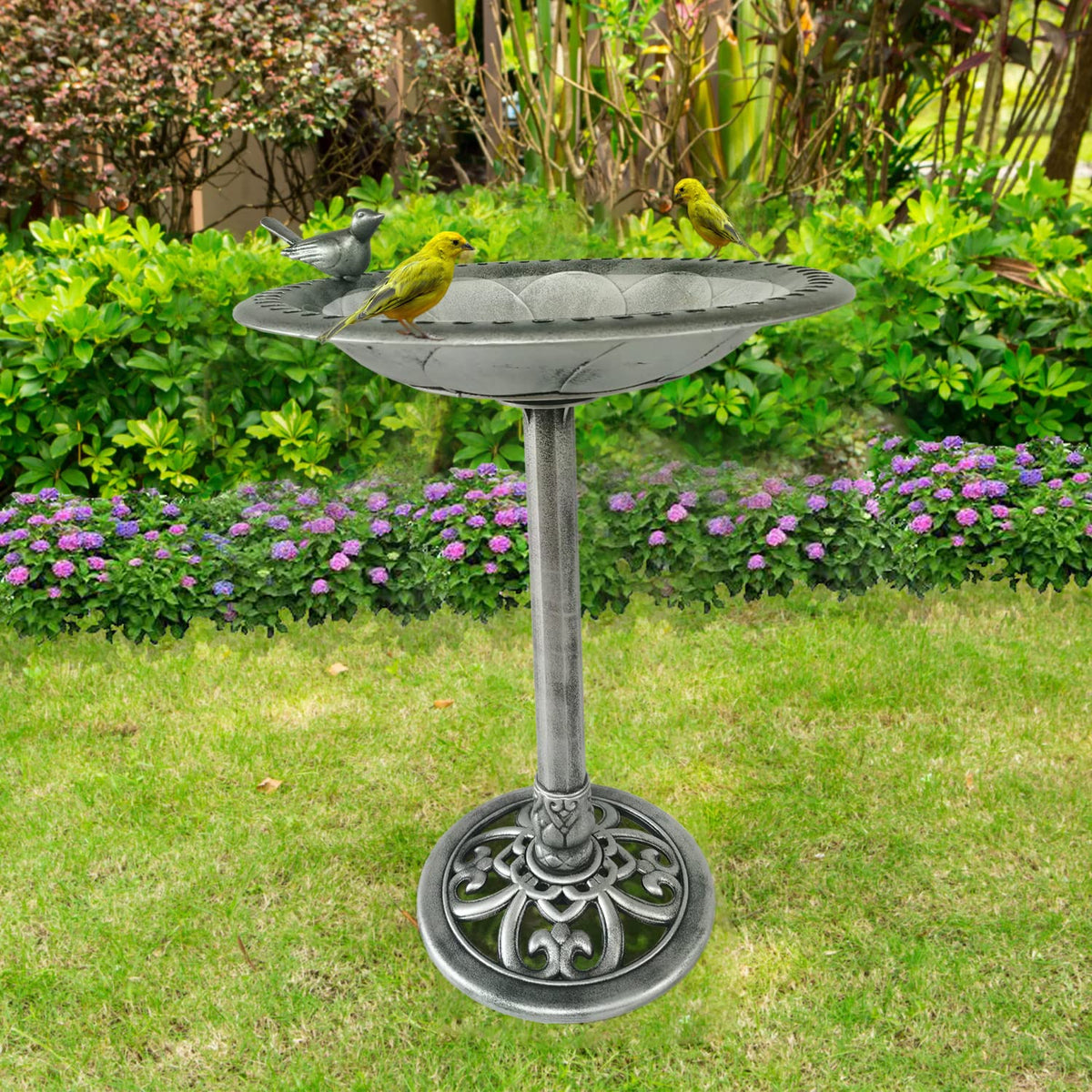 Backyard Expressions birdbath showcases detailed scrollwork on the base.