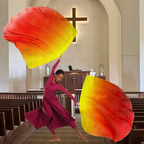 Baisdan worship flags in use during a praise dance demonstrating flowing motion.