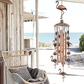 Baoxue flamingo wind chimes on patio, decorative charm and tranquil ambience.