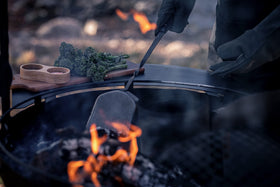 Barebones coal shovel combines sleek design with practicality in outdoor cooking spaces