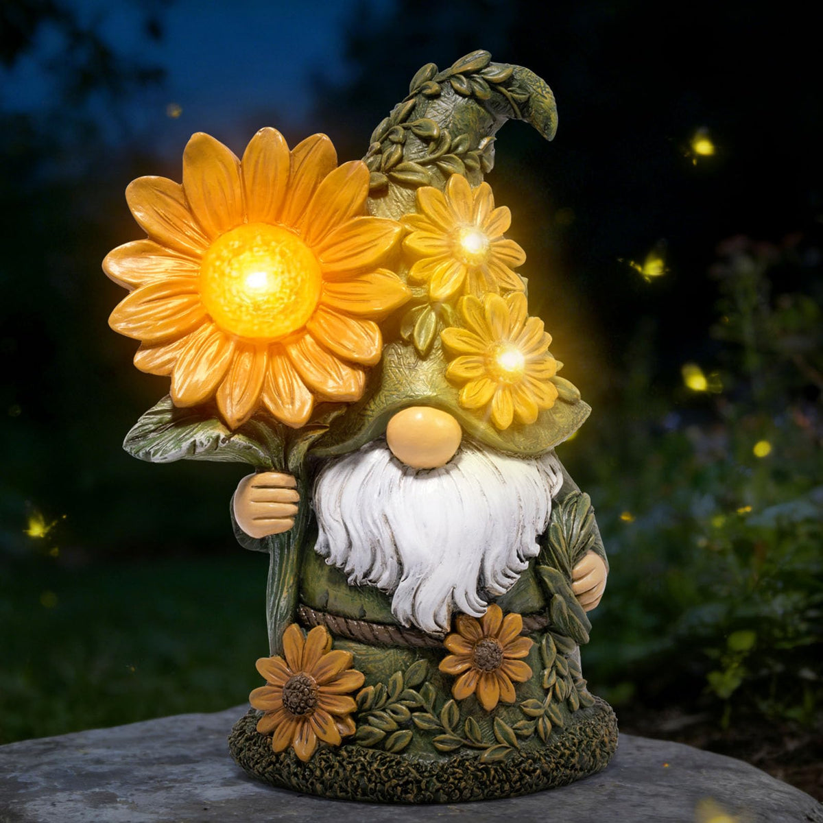 Basen solar garden gnome with glowing daisy lights the yard at night.