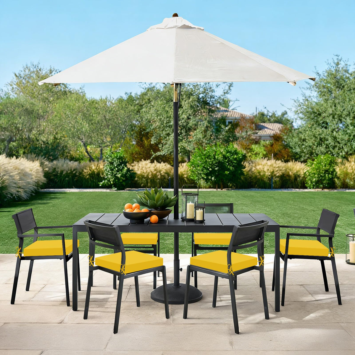 Basic Beyond patio-ready cushions add a bright yellow accent to outdoor seating.