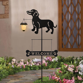 BAYN solar welcome sign lantern glow illuminates pathways at night