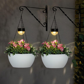 Bayn warm white LED lights automatically illuminate at dusk for subtle twilight charm.