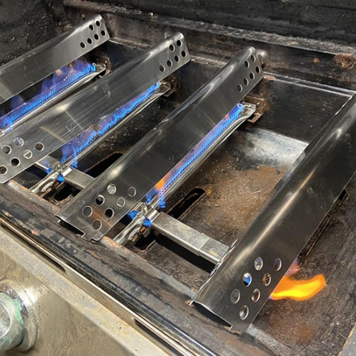BBQration tubes installed on a Char-Broil grill for even flame distribution