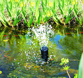Beckett all-in-one nozzle kit bubbler delivering gentle vertical bubbles in a pond