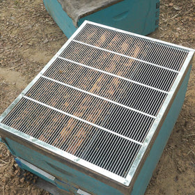 BEEXTM 8-frame excluder installed easily; smooth edges reduce hive disruption.