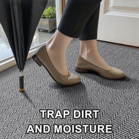 BEISIFLOOR 24x36 grey door mat demonstrates moisture and dirt absorption.