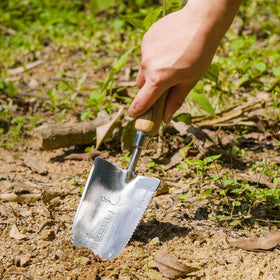 Berry&Bird serrated trowel hanging on a hook for easy storage