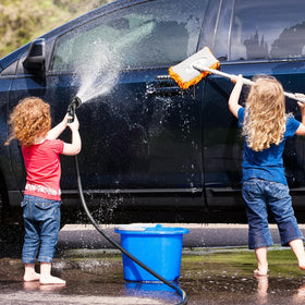 Besiter hose nozzle in use demonstrates efficient garden watering coverage.
