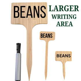 Best Pick oversized garden marker stake visible in a large plant bed