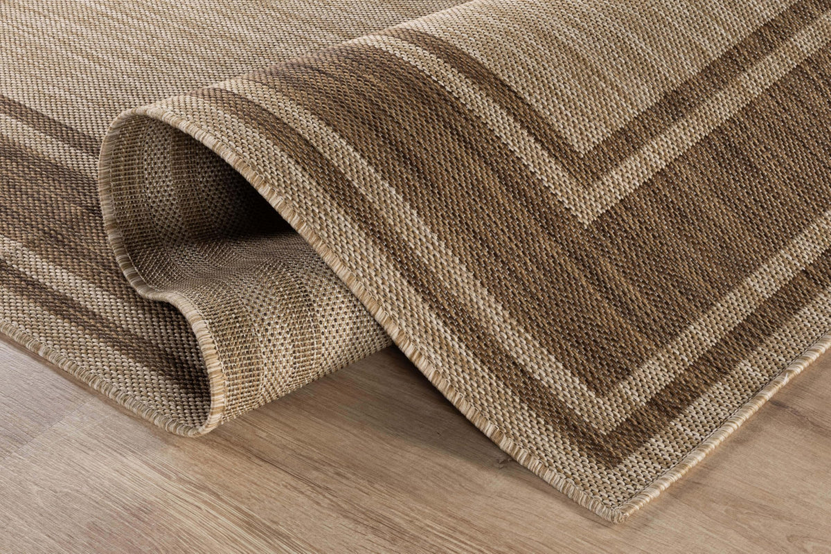 Beverly Rug dining area under table enhances outdoor dining comfort.
