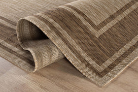 Beverly Rug dining area under table enhances outdoor dining comfort.
