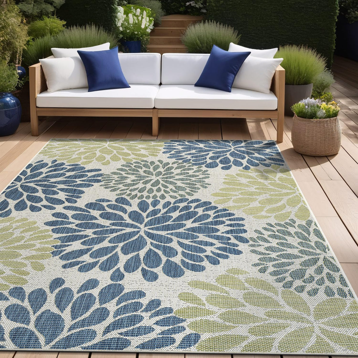 Beverly Rug indoor-outdoor use shown under a dining setup and seating area