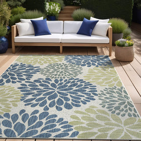 Beverly Rug indoor-outdoor use shown under a dining setup and seating area