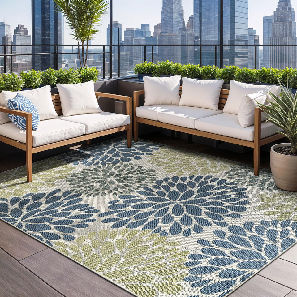 Beverly Rug outdoor rug 6x9 tropical leaf on a sunlit patio showing vibrant colors and pattern