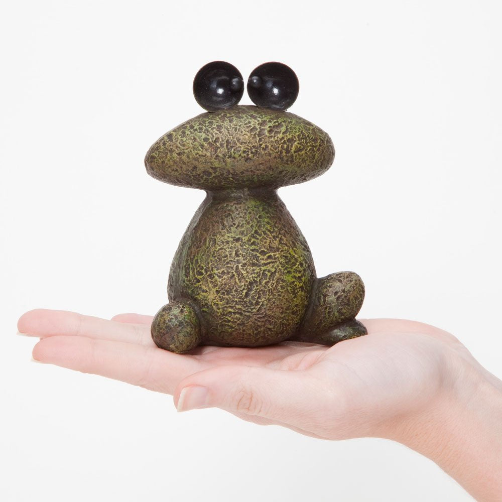Bits and Pieces frog sculptures metal eyes provide a watchful focal point outdoors.