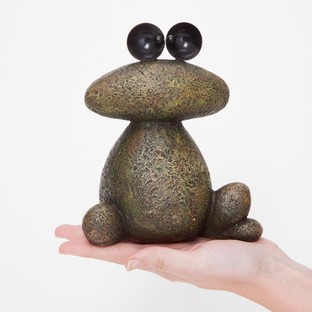 Bits and Pieces garden decor frog patio ornament brings whimsical charm to porches.