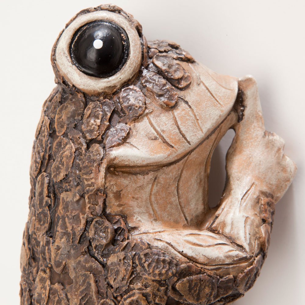 Bits and Pieces Keep Quiet Frog Tree Peeker detail face adds playful character.
